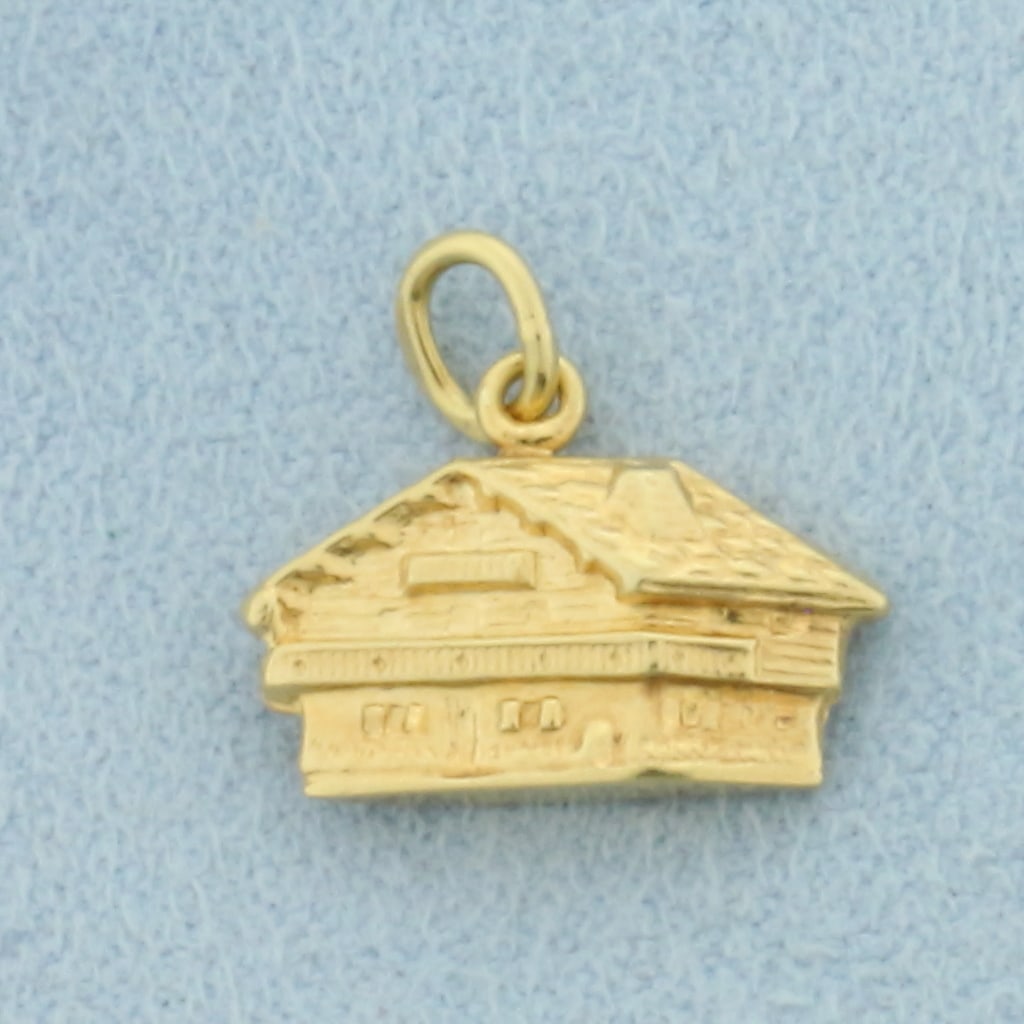 Vintage Home Charm in 14k Yellow Gold: In 14k Yellow Gold. 5/8 inch long. 3/8 inch wide. 1.0g.