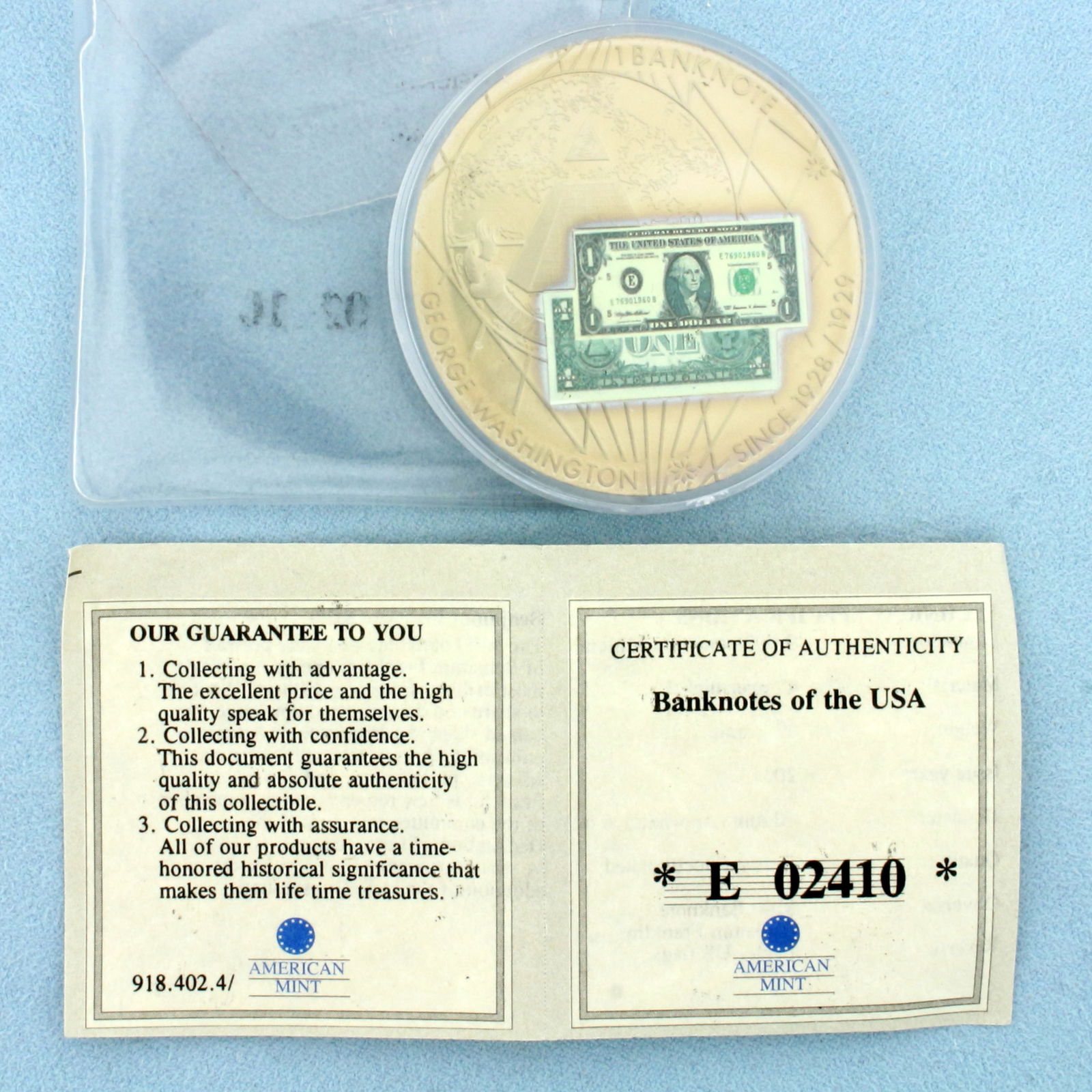 American Mint Banknotes of the USA Coin with COA: In Copper Nickel. Contains one 2001 $100 Banknote Benjamin Franklin Coin. Includes certificate of authenticity, plastic casing and sleeve. 32g.