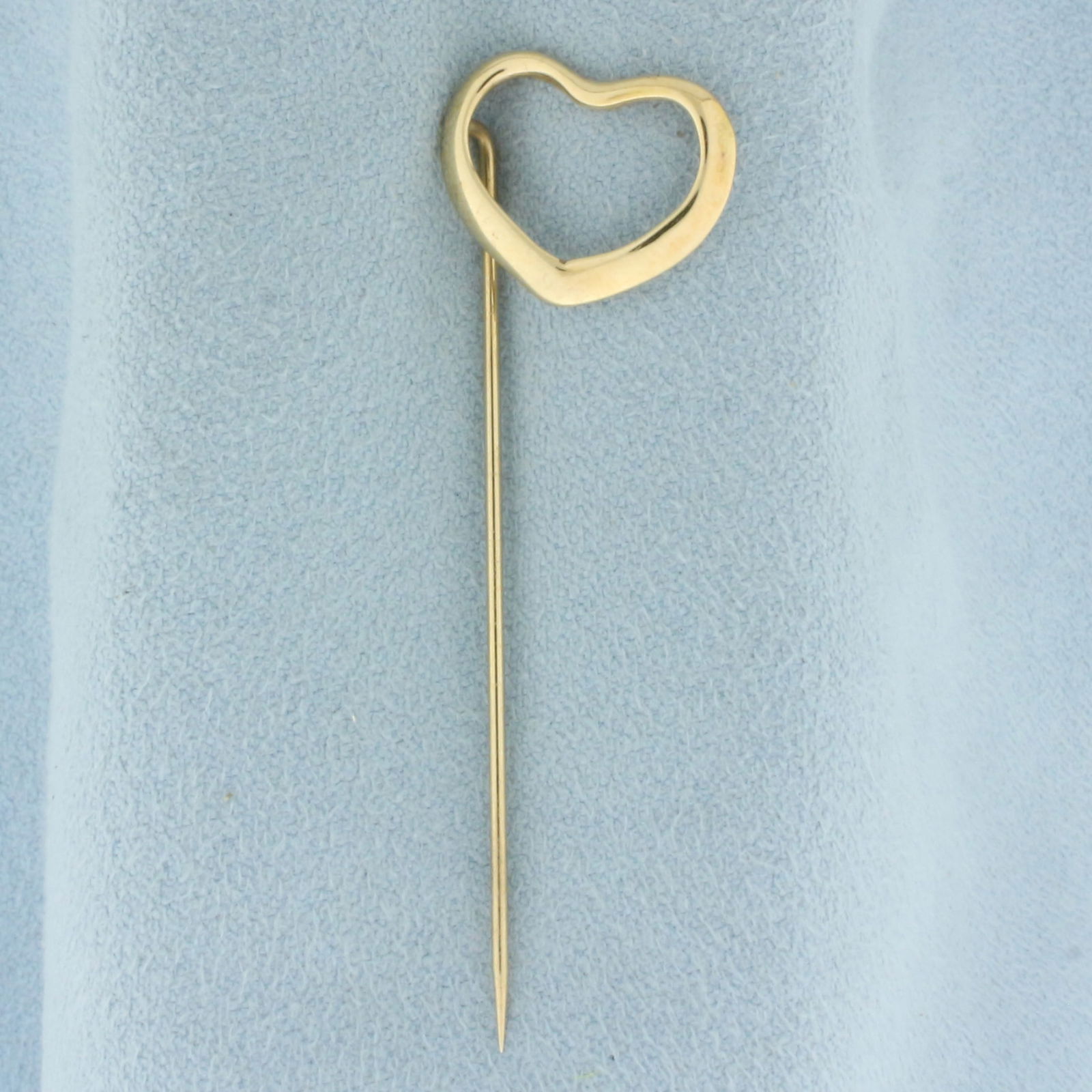 Heart Stick Pin in 14k Yellow Gold: In 14k yellow gold. 2 1/8 inches long. 1/2 inches wide at widest point. 1.2g.