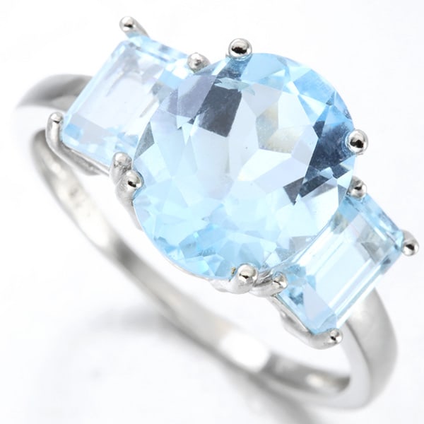Sky Blue Topaz 3-Stone Ring in Sterling Silver: In platinum over .925 sterling silver. Contains one oval cut sky blue topaz, 4.2cts, and two emerald cut sky blue topaz gems, 1.4ctw. Size 8. 3.1g