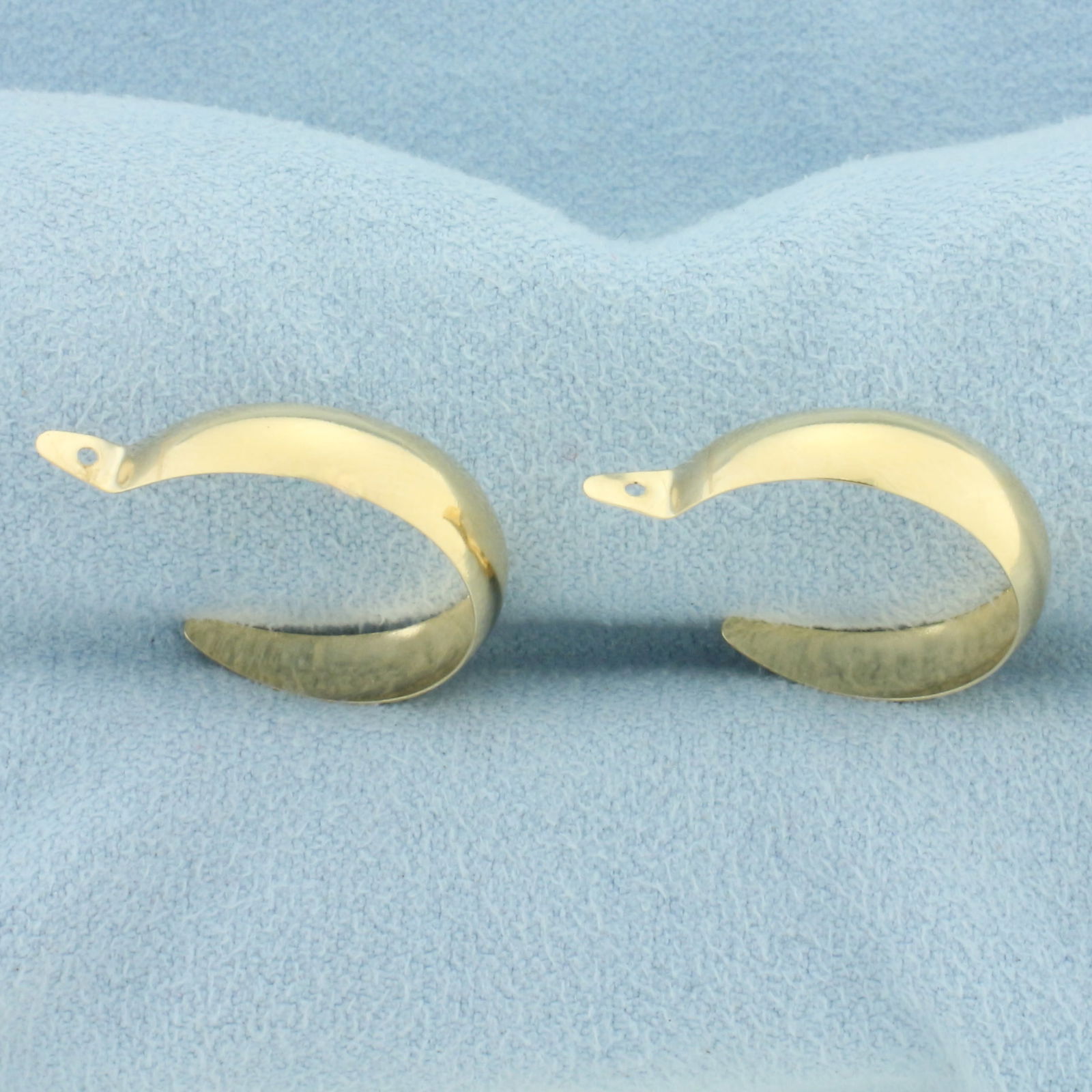 Hoop Stud Earrings Enhancers in 14k Yellow Gold: In 14k Yellow Gold. 3/4 inch long. 5.3mm wide. Designed to fit on diamond stud earrings to give a fresh new look. 1.0g.