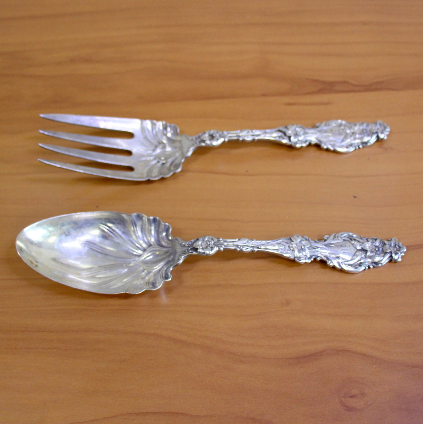 Whiting "Lilly" Solid Salad Serving Spoon and Fork Set in Sterling Silver: In .925 Sterling Silver. Contains one solid salad serving spoon, 9 1/8 inch long and one solid salad serving fork, 9 1/8 inch long. Antique "M" monogram. 220.4g.
