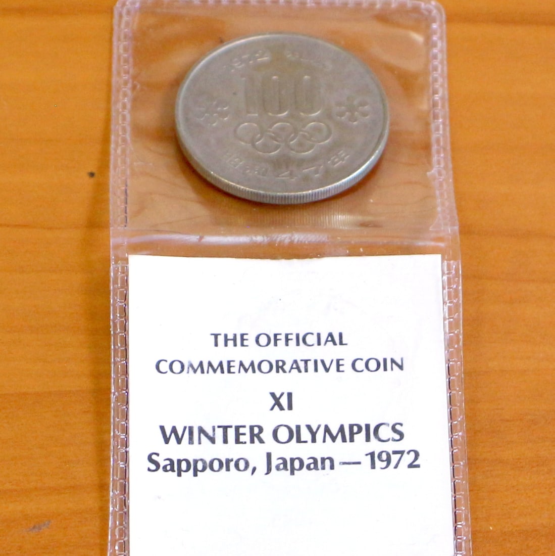 1972 Japanese Olympic Coin 100 Yen: 1972 Japanese Olympic Coin. Includes plastic sleeve.