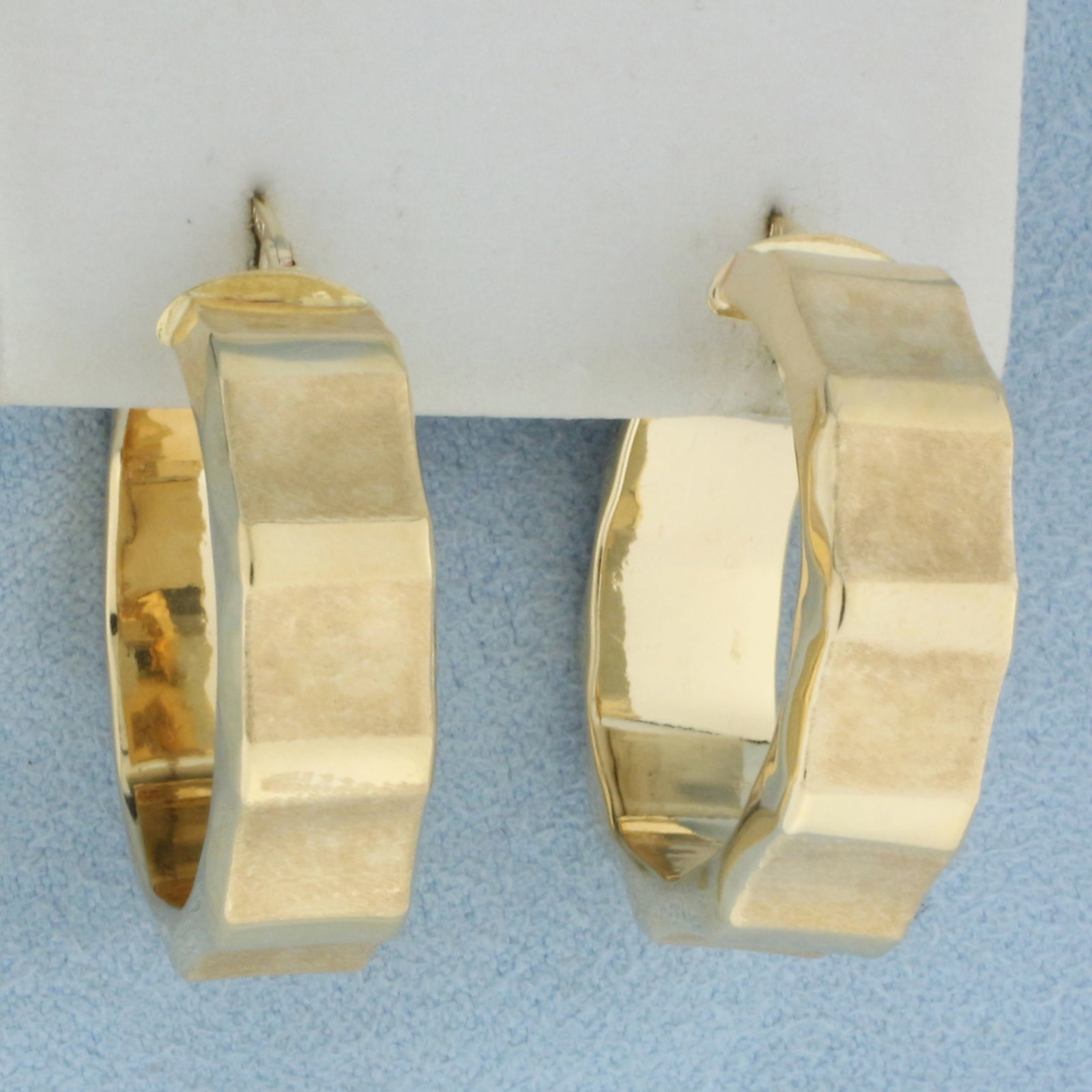 Italian Dual Finish Wide Hoop Earrings in 14k Yellow Gold: In 14k yellow gold. Italian made. 1 1/8 inches long. 8mm wide. Satin and high polish alternating finish. Locking leverback closures. 5.0g.