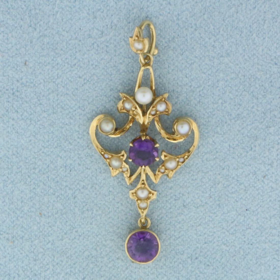 Vintage Amethyst and Pearl Pendant in 14k Yellow Gold: In 14k Yellow Gold. Contains fifteen 1mm to 2mm high quality cultured pearls with high luster. Also contains two 4mm to 5mm high quality natural amethyst gemstones with vibrant color. 1 3/8 inch long,