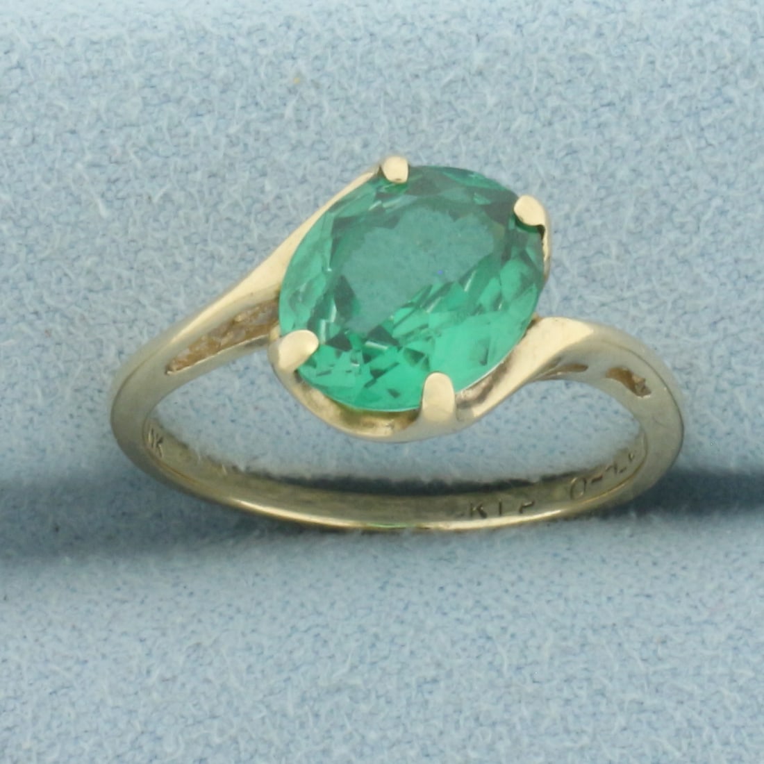 Green Topaz Solitaire Ring in 10k Yellow Gold: In 10k Yellow Gold. Contains one 10mmx8mm high quality natural Green Topaz gemstone with intense emerald green color and excellent clarity. Size 8. 2.6g.