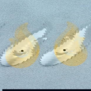 Swoop Teardrop Stud Earring Enhancers in  14k Yellow Gold: In _k Yellow Gold. 7/8 inch long. 1/2 inch wide. Made to go around diamond stud earrings to give a new look. 1.0g.