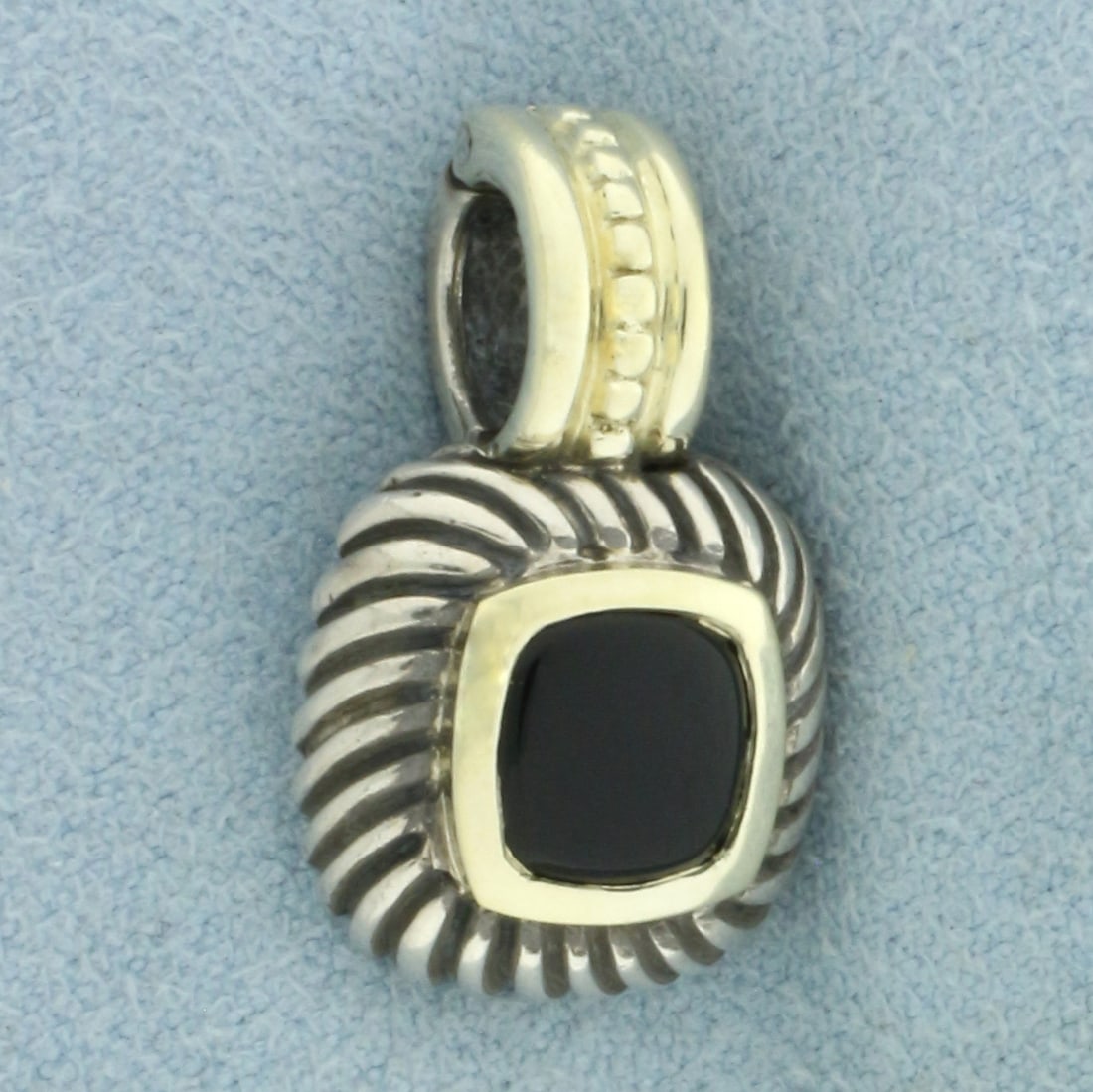 David Yurman Onyx Albion Pendant in Sterling Silver and 14k Yellow Gold: In .925 Sterling Silver and 14k Yellow Gold. Guaranteed authentic. Contains one high quality 7x7mm onyx gemstone. 7/8 inch long. 1/2 inch wide. Hinged opening for easy on/off. 5.2g.