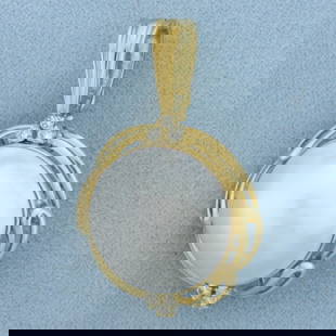 Large Mabe Pearl and Diamond Statement Pendant in 18K Yellow Gold: In 18K Yellow Gold. Contains a high quality natural 19.5mm Mabe Peal with excellent luster and a beautiful white silver color. Also contains six high quality .03ct Diamonds, VS clarity/H color. 1