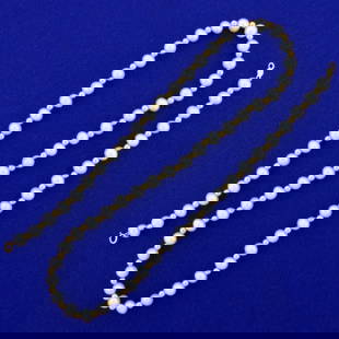 18 Inch Cultured Pearl and Gold Bead Necklace in 14K Yellow Gold: In 14K Yellow Gold. Contains sixty one high quality Cultured Pearls, ranging from 5 5.5mm each, all with great color and luster. Gold beads measure 3mm. 18 inches long. Pears with lot 11282, pearl