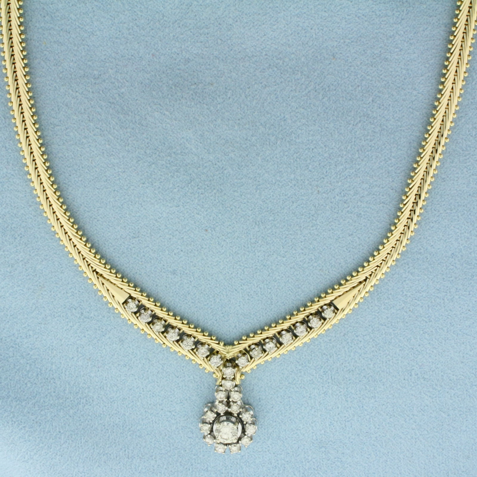 Italian Designer Diamond Necklace in 14k Yellow Gold: In 14k Yellow Gold. Contains twenty nine high quality diamonds ranging from .35ct to .04ct each, 1.5ct TW, SI clarity/H color. Italian made. 18 inches long. Concealed slide clasp with safety latch. 31