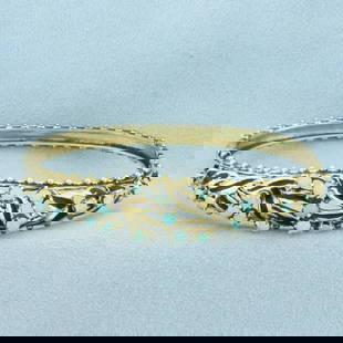 Antique Enamel Hinged Opal Bangle Bracelet in 14k Yellow Gold: In 14k Yellow Gold. Contains nineteen high quality 2.5 to 2.7mm opals with flashes of blue, orange and pink. Interior dimensions: 2 1/4 inches long. 1 3/4 inch wide. Black enamel detailing. Hinged loc