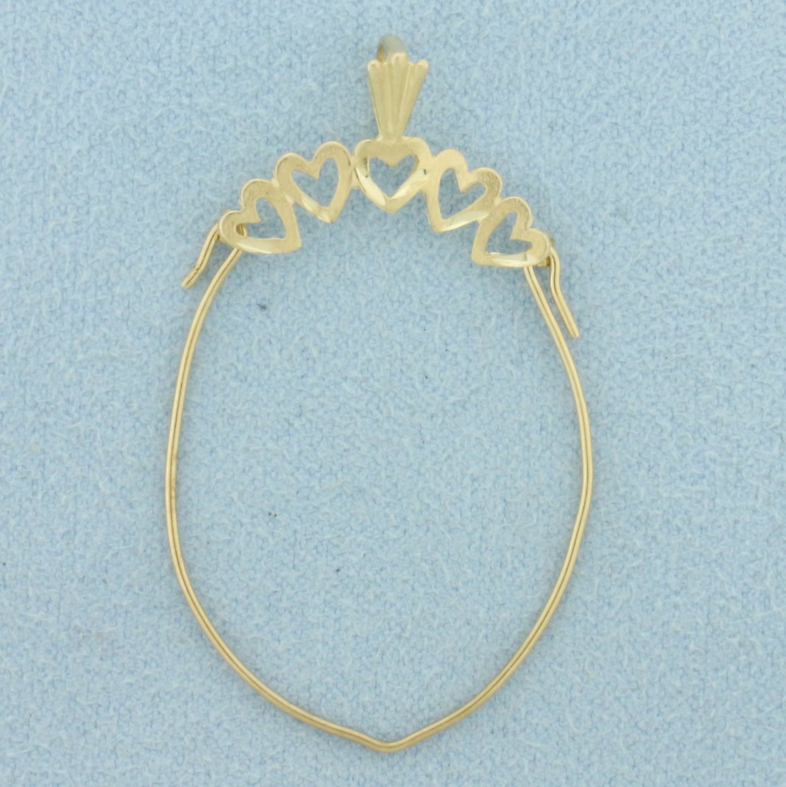Heart Charm Holder Pendant in 14k Yellow Gold: In 14k Yellow Gold. 1 5/8 inch long. 1 inch wide at widest. 1.0g.