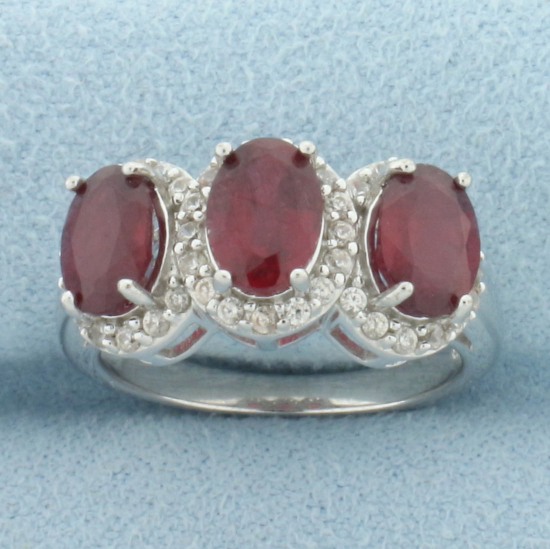 Madagascar Ruby and White Zircon Ring in Sterling Silver: In .925 sterling silver. Contains three high quality Madagascar Ruby gemstones, 2.75ct TW, with intense color and excellent clarity. Accented with 1/2ct TW of White Zircon gemstones. Size: 6. 4.2g.