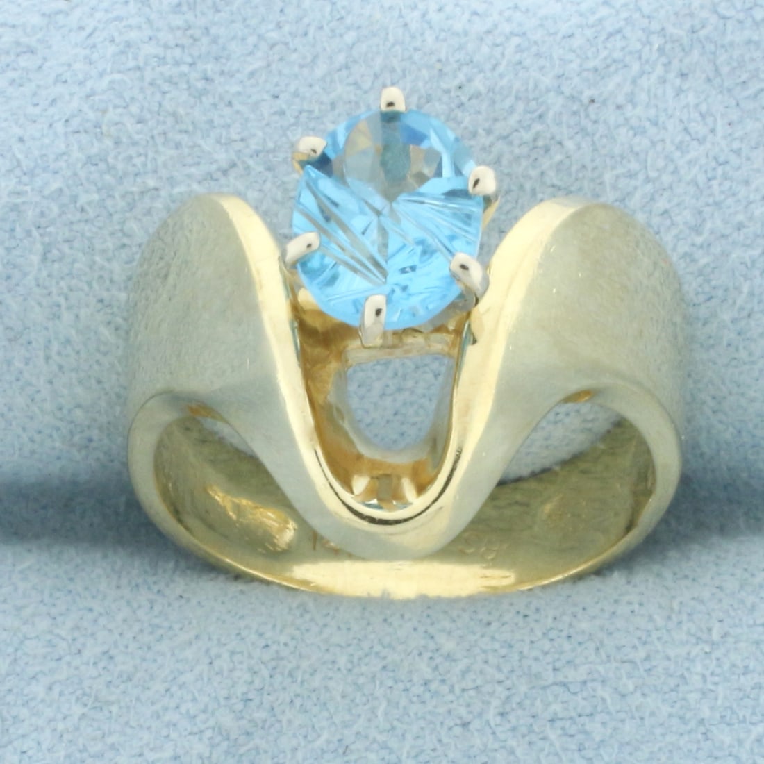 Fancy Oval Cut Swiss Blue Topaz Ring in 14k Yellow Gold (1 of 4)