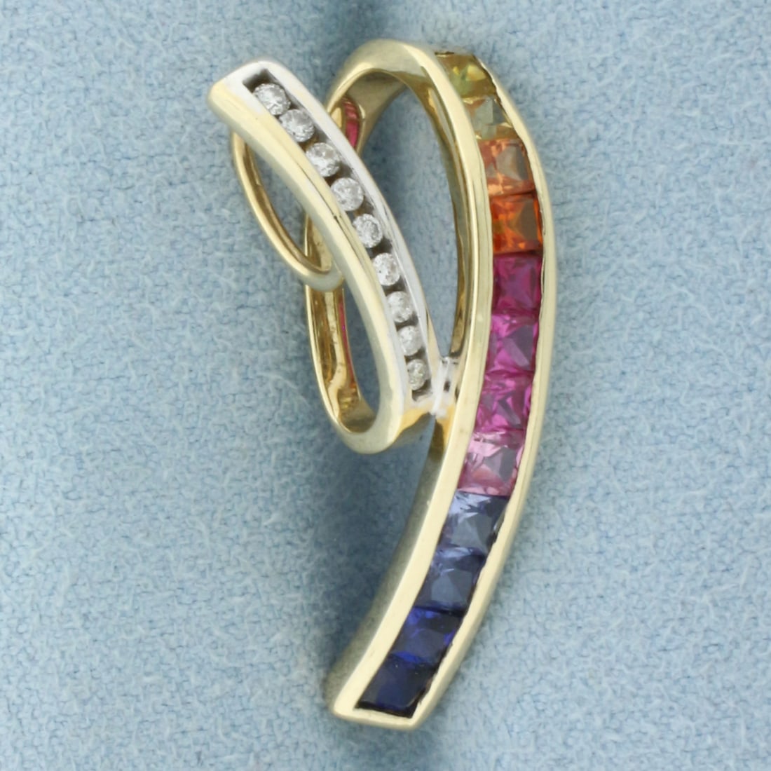 Rainbow Lab Sapphire and Diamond Pendant Slide in 10k Yellow Gold: In 10k Yellow Gold. Contains high quality natural 2mm to 3mm Lab Sapphire gemstones with intense color and excellent clarity. Also contains nine .01ct diamonds, SI clarity/H color. 1 1/8 inch long. 1/