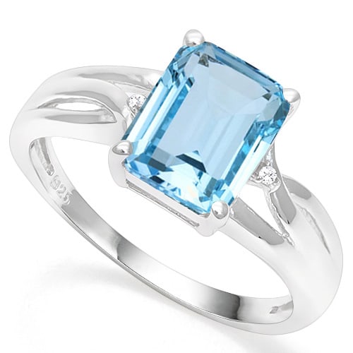 Emerald Cut Blue Topaz & Diamond Ring in Sterling Silver: In platinum over .925 sterling silver. Contains one 2.8ct blue topaz gemstone, accented with two genuine diamonds, .01ctw. Size 8. 2.3g
