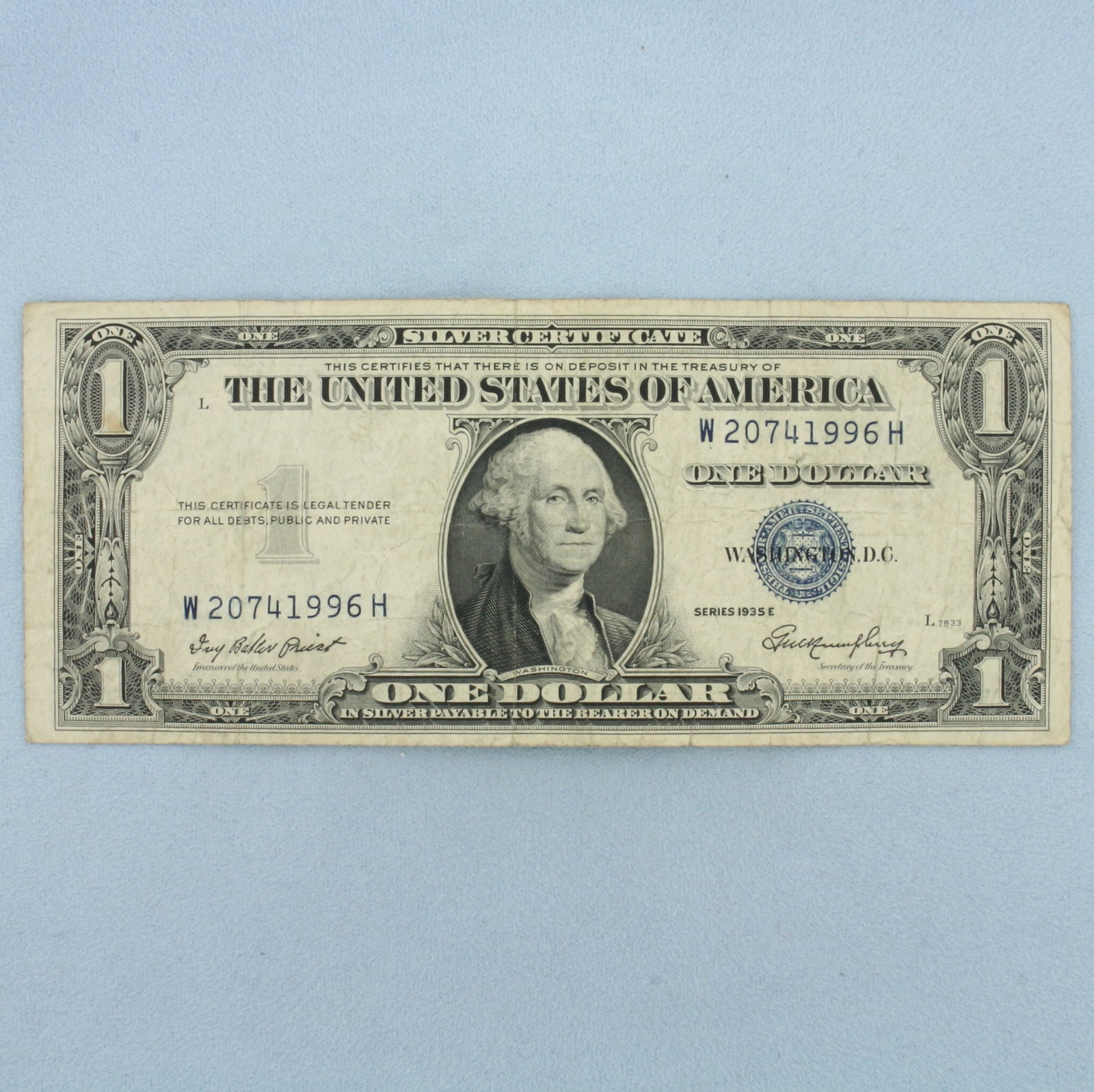 1935 or 1957 $1 Silver Certificate Blue Seal Bill: $1 One Dollar Silver Certificate banknote with a blue seal, circulated condition. No rips or tears on note, typical circulated condition.