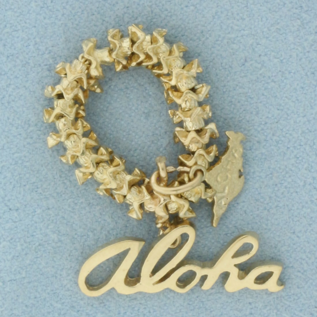 3-D Hawaii Aloha Lei Pendant or Charm in 14k Yellow Gold: In 14k Yellow Gold. 1 1/4 inch long (including jump ring). 1/2 inch wide. 6.0g.