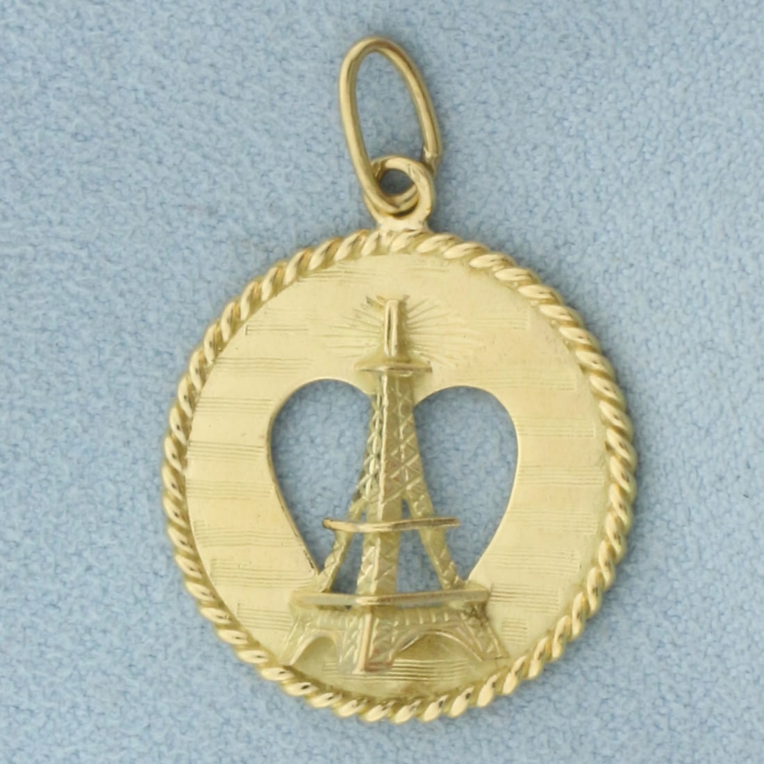 3-D Eiffel Tower Heart Charm or Pendant in 18k Yellow Gold: In 18k Yellow Gold. 1 1/4 inch long (including jump ring). 7/8 inch wide. 3.7g.