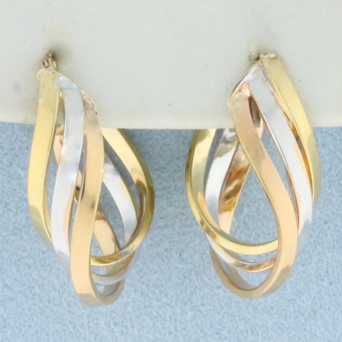 Tri-Color Twisting Oval Hoop Earrings in 14k Yellow, White, and Rose Gold (1 of 2)
