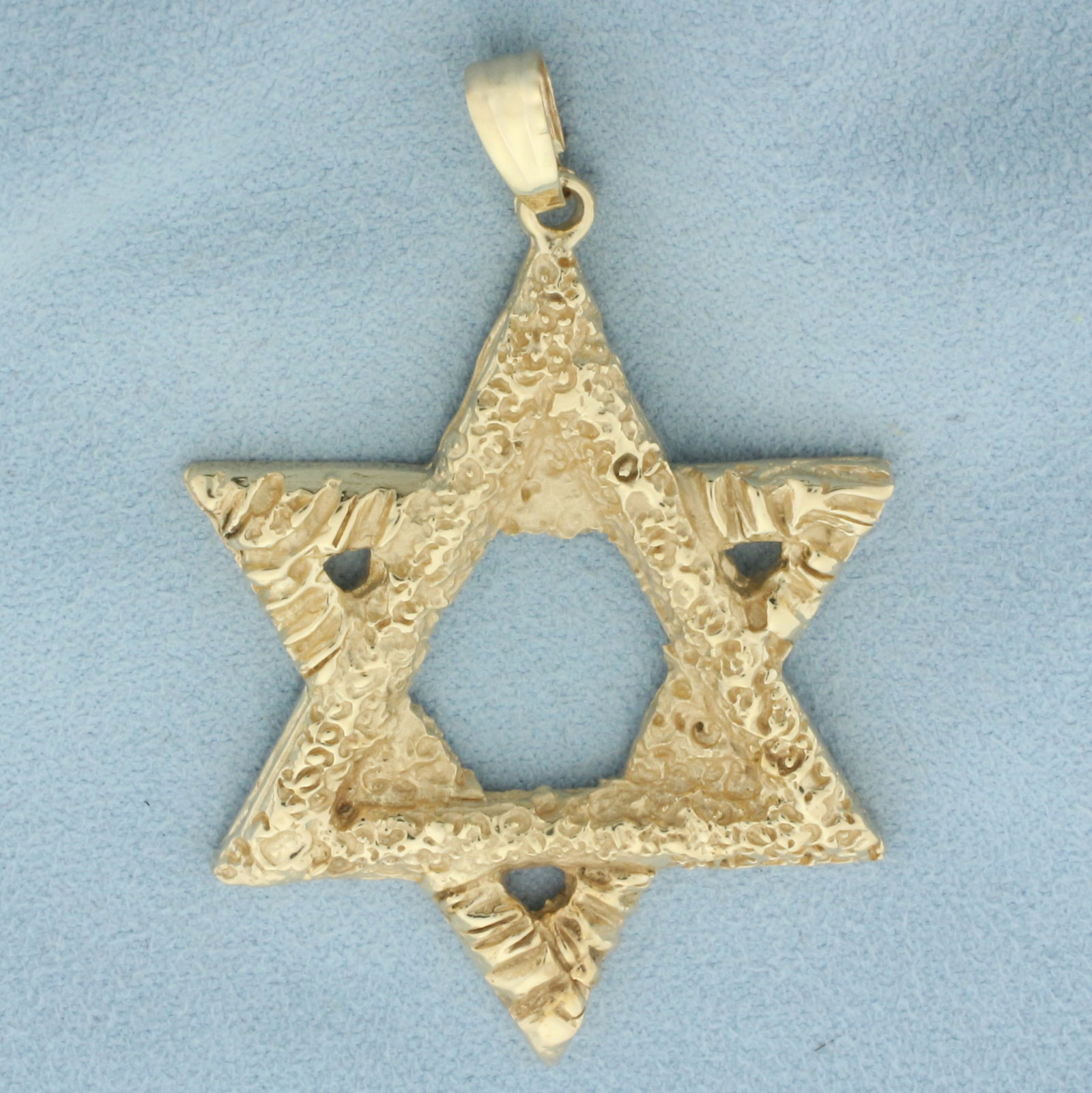 Large Star of David Pendant in 14k Yellow Gold: In 14k yellow gold. 2 3/8 inches long (including bale) and 1 1/2 inches wide. Unique sandblast finish. 16.96g.