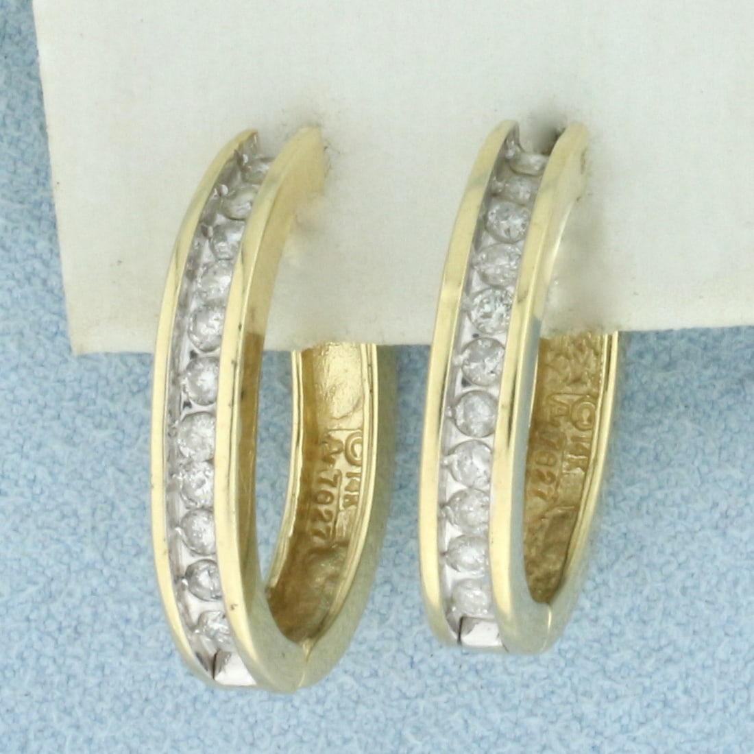 Diamond Hoop Earrings in 14k Yellow Gold: In 14k Yellow Gold. Contains twenty two high quality diamonds, 1/2ct TW, I color/I clarity. 3/4 inch long. 5/8 inch wide. Hinged locking closure. 5.5g.
