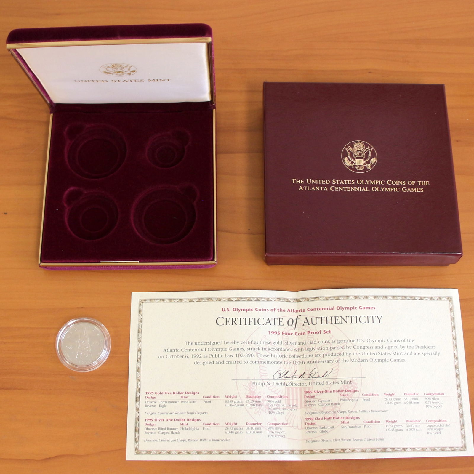 1995 US Mint Atlanta Olympics Coin: Contains one 1995 Clad Half Dollar U.S. Atlanta Centennial Olympic Coin. Does not include silver or gold coins. Includes original box.