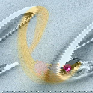 Abstract Designer Diamond Garnet and Topaz Swoosh Pendant in 14k Yellow Gold: 14k yellow gold. Contains one 3.6mm high quality natural garnet gemstone with deep color and excellent clarity. Also contains one .08ct high quality diamond, H color/I clarity. Also contains one 2mm h