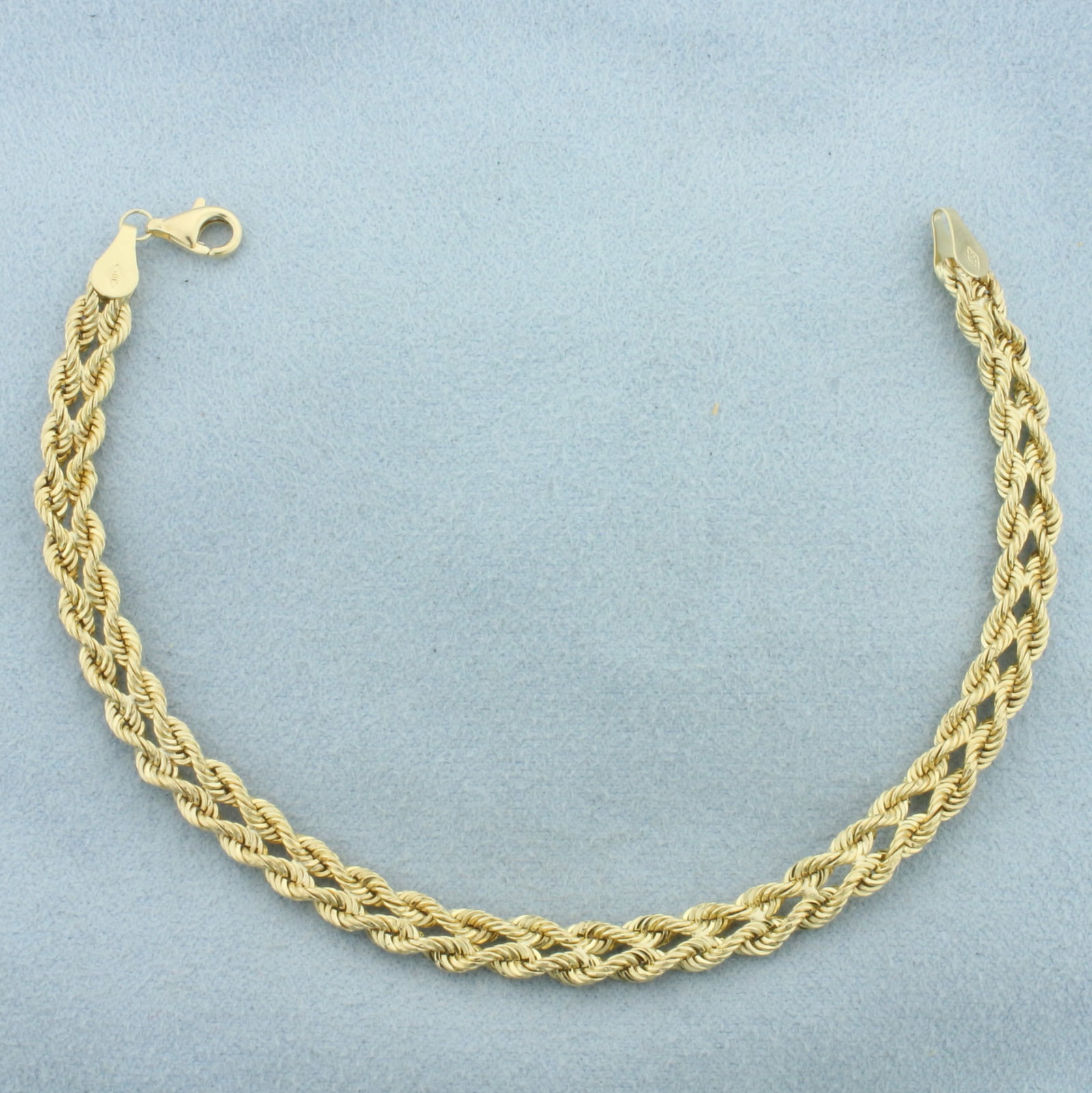 Double Rope Bracelet in 10k Yellow Gold: In 10k Yellow Gold. 7 3/8 inches long. 5.5mm wide. Lobster clasp. 2.1g.