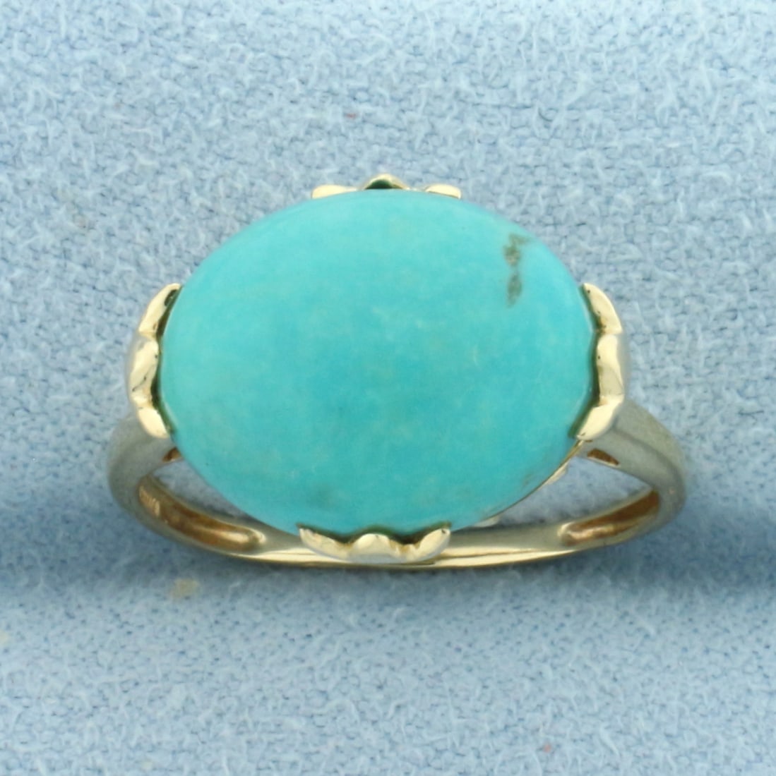 Turquoise Solitaire Ring in 14k Yellow Gold: In 14k Yellow Gold. Contains one high quality natural 14MM x 11 mm Turquoise gemstone with beautiful baby blue color. Size 7. 3.0g.