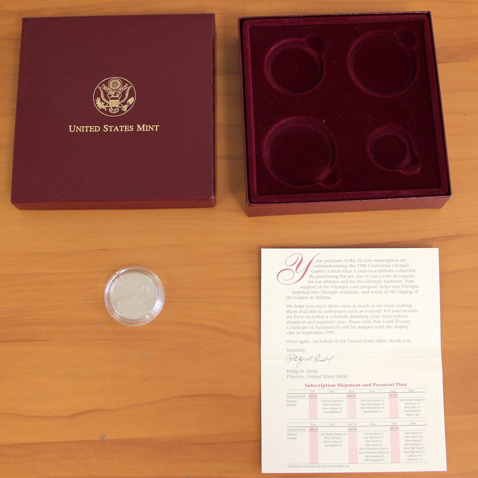 1995 US Mint Atlanta Olympics Coin: Contains one 1995 Clad Half Dollar U.S. Atlanta Centennial Olympic Coin. Does not include silver or gold coins. Includes original box.