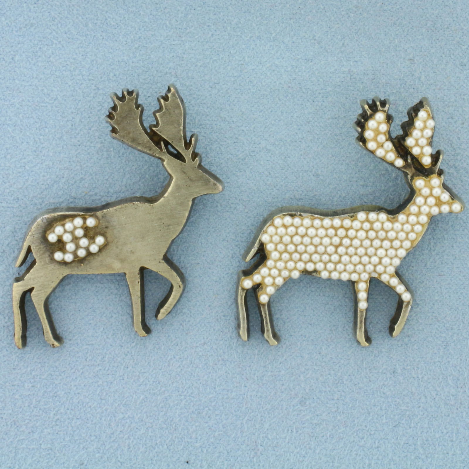 Chanel 01A CC Pearl Deer Brooches Set of 2: 1 1/2 inches long. 1 1/8 inch wide. From season 01A. Rare set of gripoix pearl accented deer brooches. Beautiful condition with all pearls.