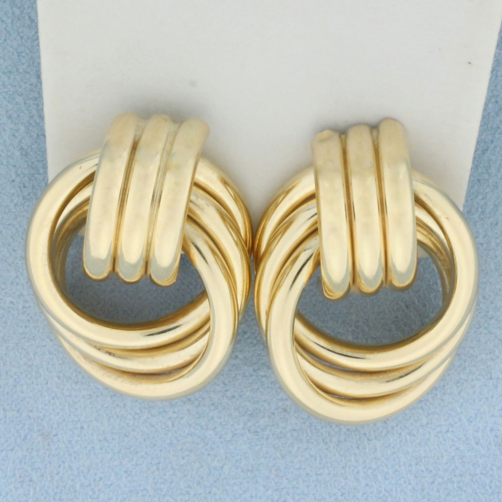 Designer Hoop Earrings in 14k Yellow Gold: In 14k Yellow Gold. 1 inch long. 7/8 inch wide. Omega backs. 10.5g.