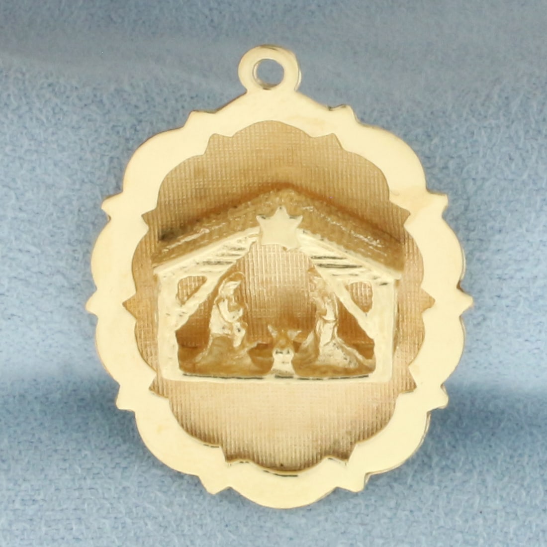 Jesus Nativity Scene Pendant in 14k Yellow Gold: In 14k yellow gold. 1 1/4 inches long and 1 inch wide. 4.5g.