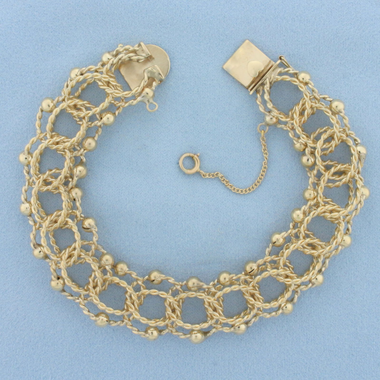 Wide Twisting Loop Rope Charm Bracelet in 14k Yellow Gold (1 of 2)