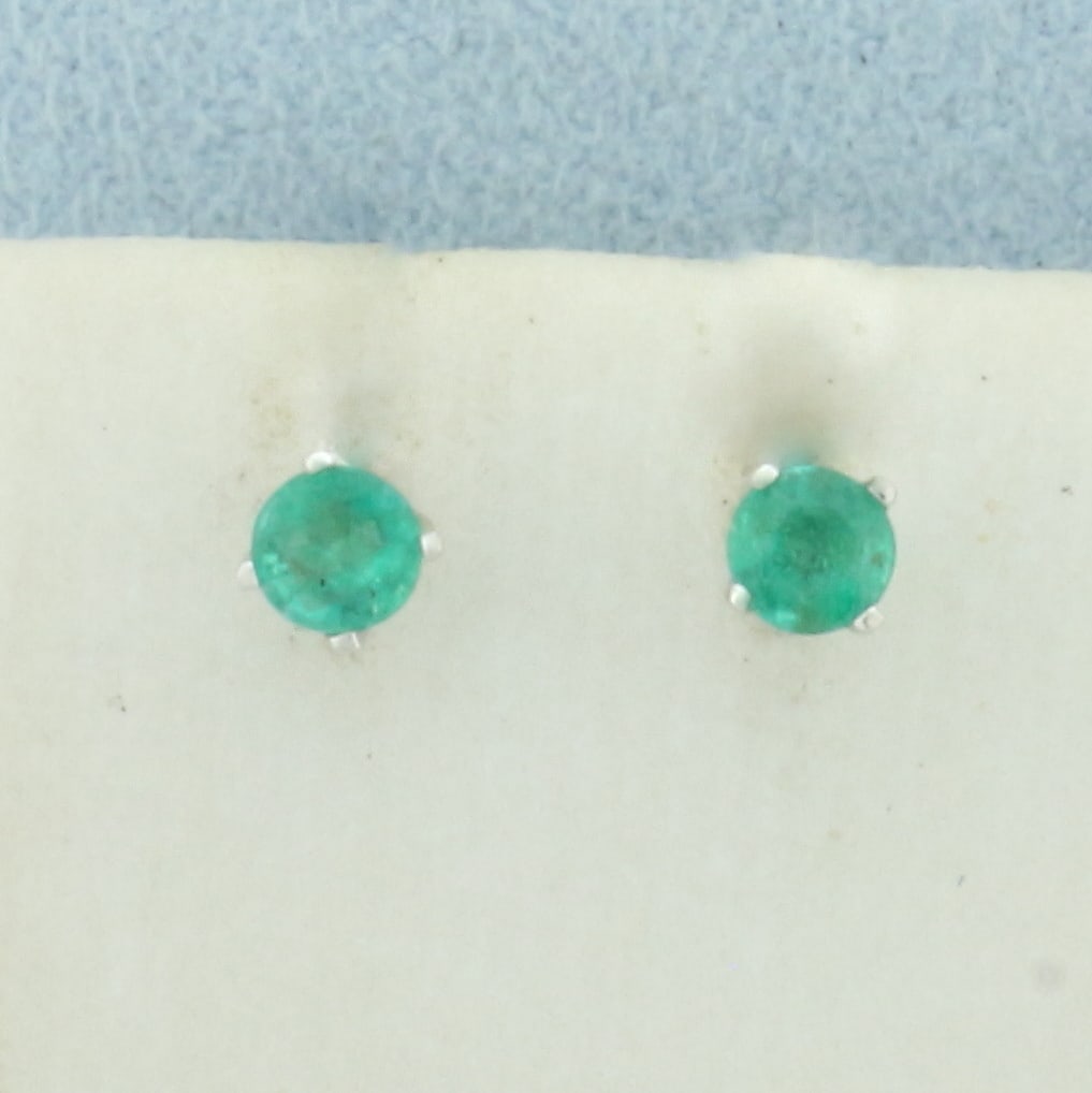 Emerald Stud Earrings in 14k White Gold: In 14k White Gold. Contains two 3.6mm high quality natural Emerald gemstones with vibrant color and excellent clarity. Friction backs. .6g.
