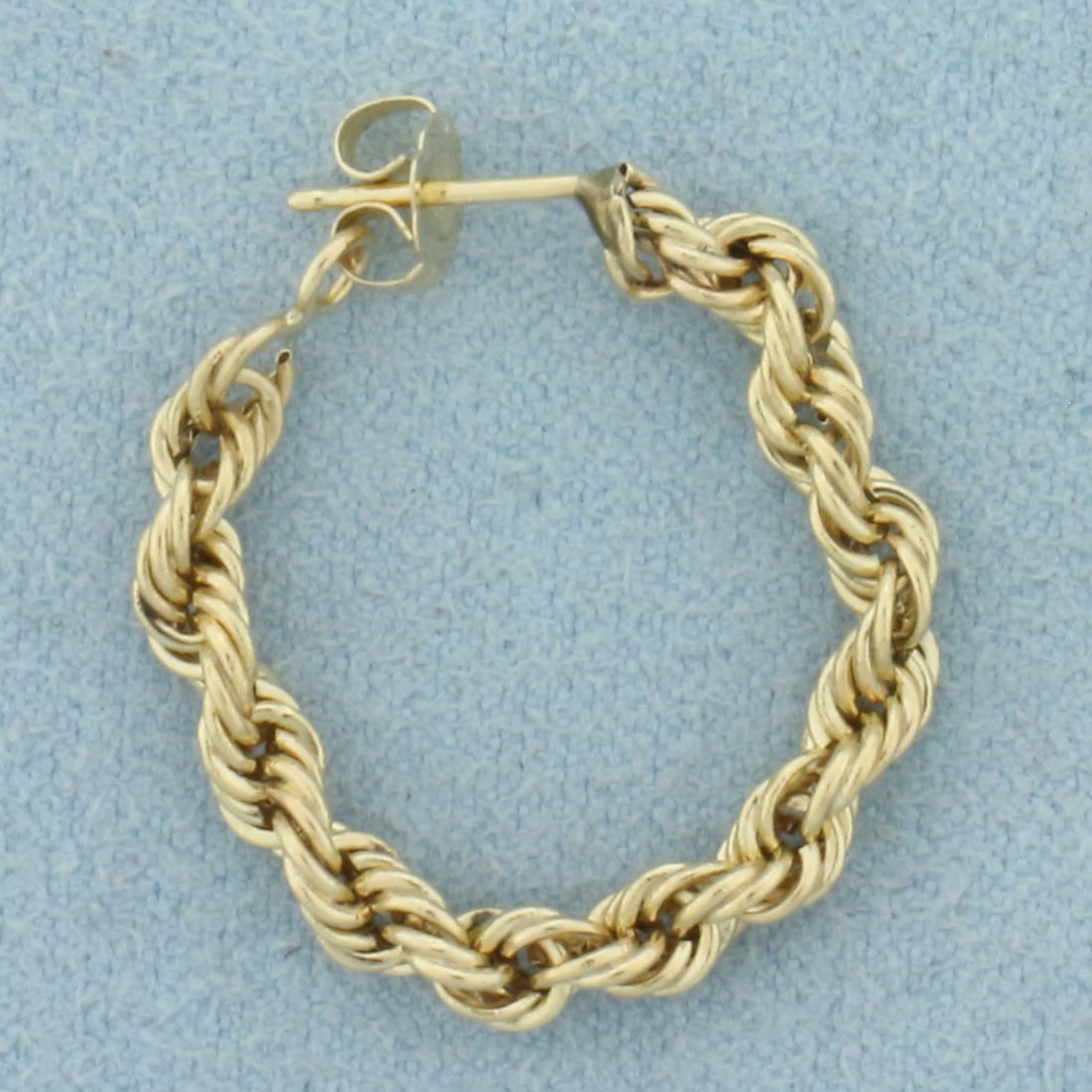 Single Rope Front to Back Hoop Earring in 14k Yellow Gold: In 14k Yellow Gold. 1 inch diameter. 3.2mm wide. Friction back. Perfect for second hole in ear. .9g.