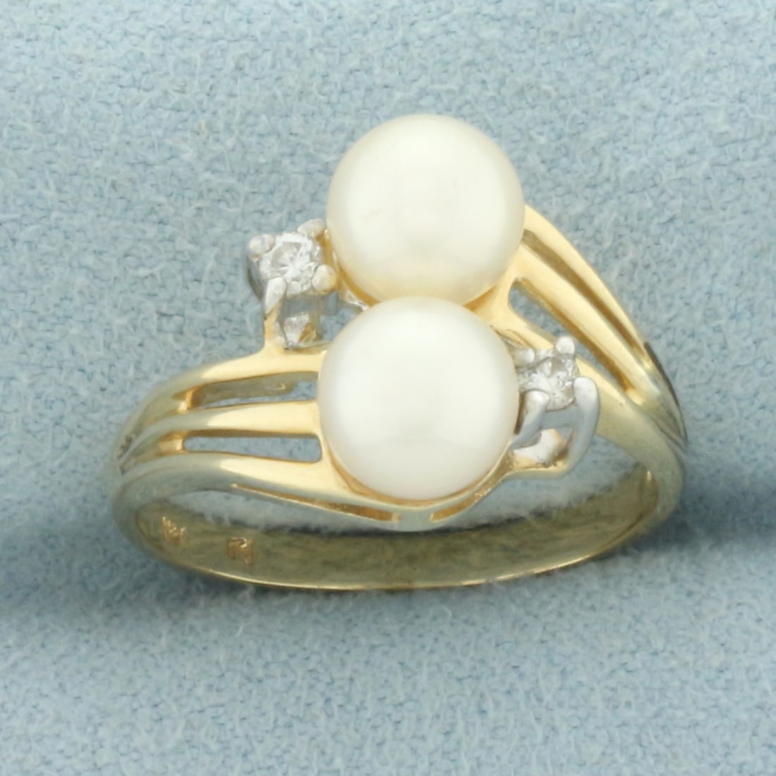 Cultured Akoya Pearl and Diamond Toi et Moi Ring in 14k Yellow Gold: In 14k yellow gold. Contains two high quality 6.4mm akoya pearls with high luster. Also contains two high quality .04ct diamonds, SI clarity/H color. 12.8mm wide at top of ring. Size: 6. 3.7g.