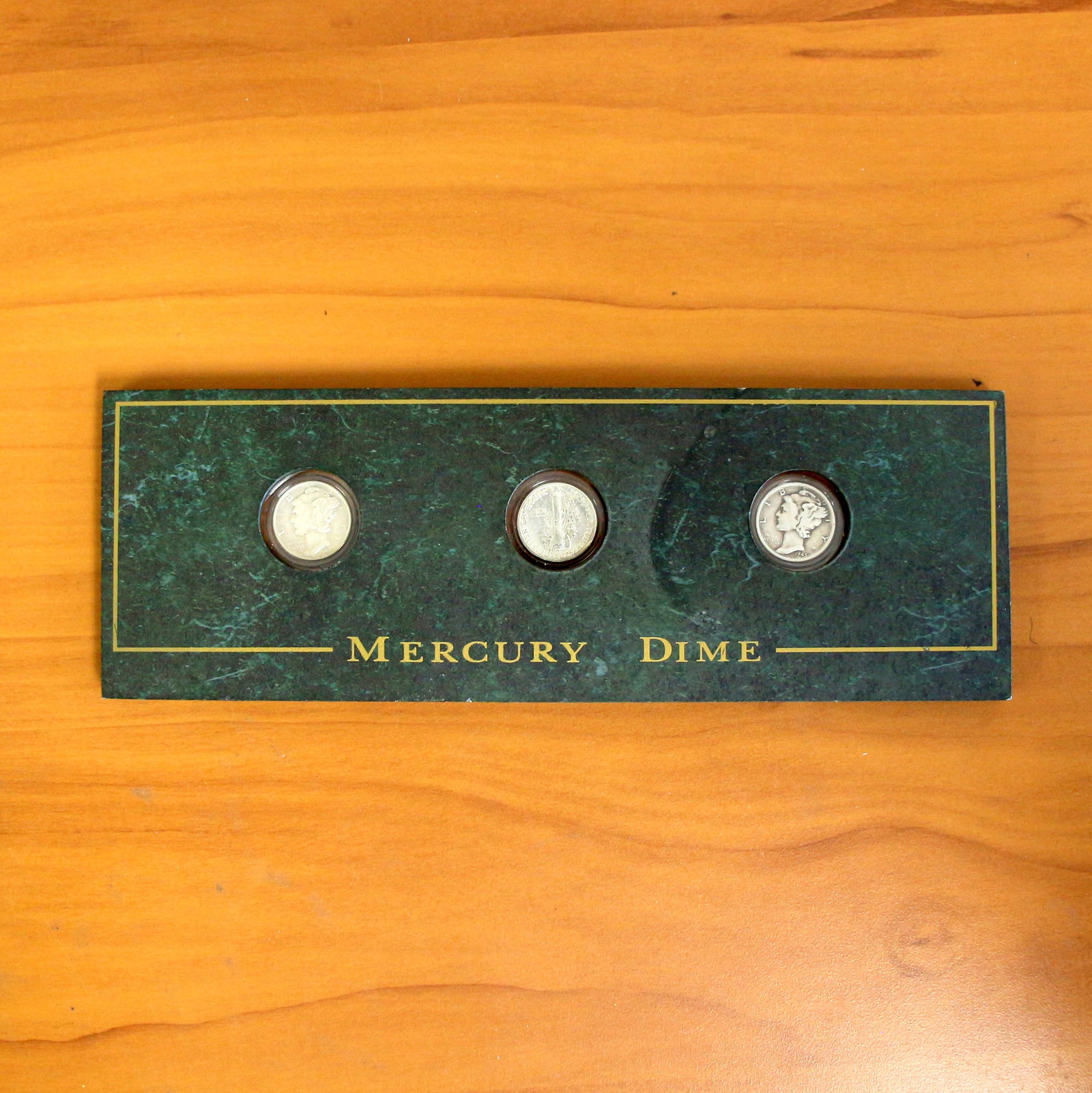Mercury Dime Coin Set In Case: Contains three U.S. Mint Mercury Dimes ranging from 1939-1945. Set in block casing.