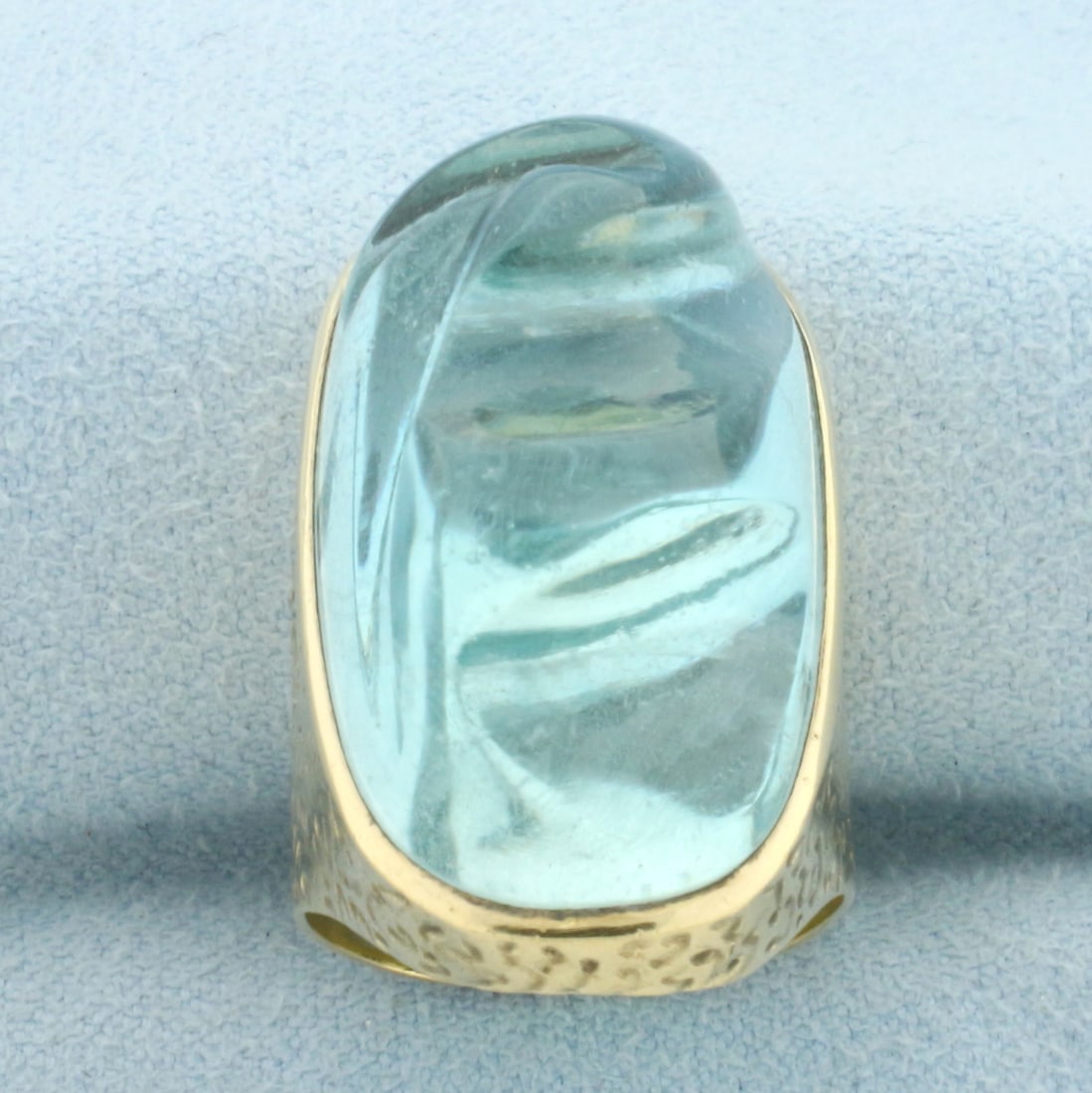 Aquamarine Forma Livre Hand Carved Statement Ring in 18k Yellow Gold: In 18k Yellow Gold. Contains one high quality natural polished fancy cut Aquamarine gemstone with vibrant color. Free form hand carved gemstone pioneered by Haroldo & Roberto Burle Marx. 1 1/8 inch lo