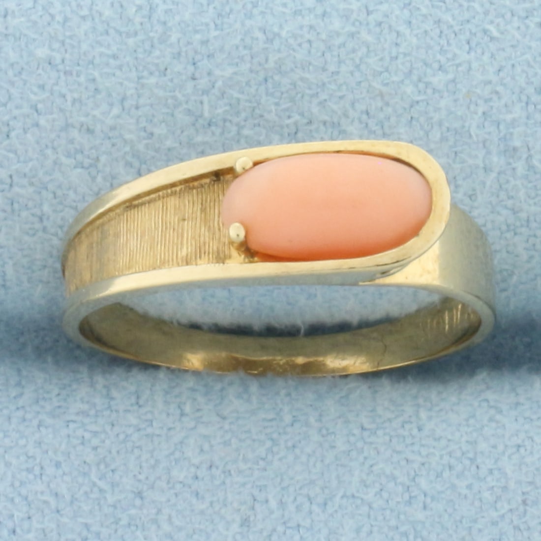Vintage Pink Coral Ring in 10k Yellow Gold: In 10k yellow Gold. Contains one high quality 8.8mm by 4mm Pink Coral gemstone with beautiful pastel pink color. High polished and brushed gold. Size: 6.5. 2.0g.