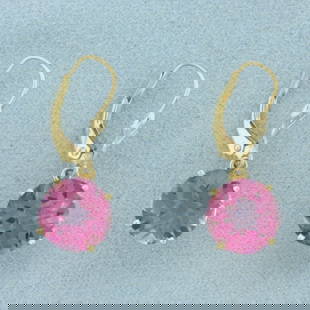Checkerboard Cut Pink Topaz Dangle Earrings in 14k Yellow Gold: In 14k Yellow Gold. Contains two 10mm high quality fancy checkerboard cut natural Pink Topaz gemstones, approximately 7ct TW, with intense color and excellent clarity. 1 inch long. 10mm wide. Leverbac