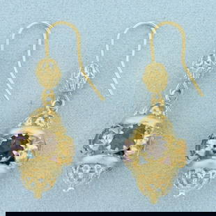 Multi Color Gemstone Dangle Chandelier Lantern Earrings In 18k Yellow Gold: In 18k yellow gold. Each earring contains five 1ct high quality natural gemstones including amethyst, blue topaz, citrine, garnet, and smoky topaz. Each with vibrant color and excellent clarity. Earri