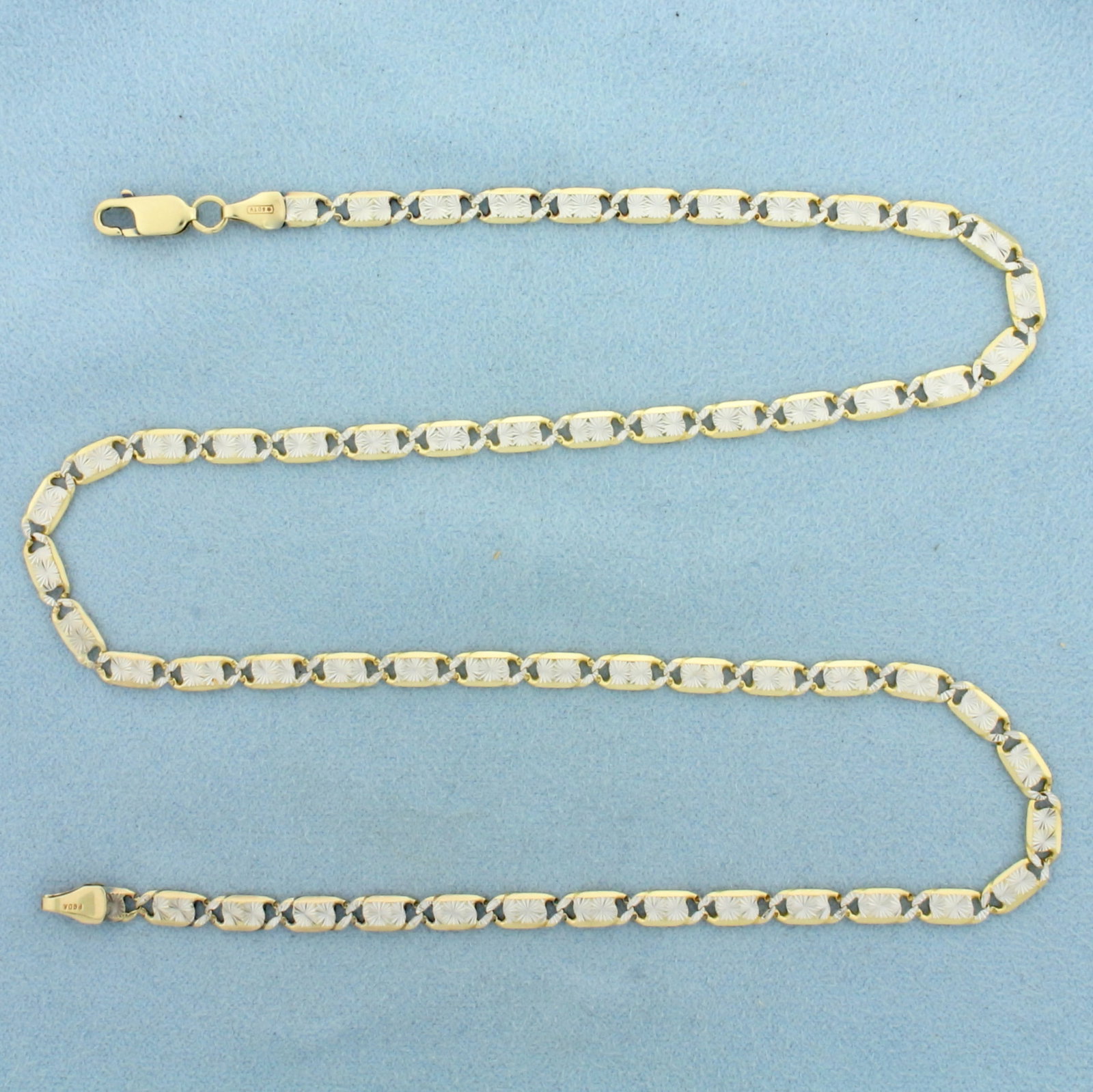 18 Inch Italian Diamond Cut Fancy Anchor Link Chain Necklace in 10k Yellow and White Gold: In 10k Yellow and White Gold. 18 inches long. 3.8mm wide. Italian made. Lobster clasp. 12.0g.