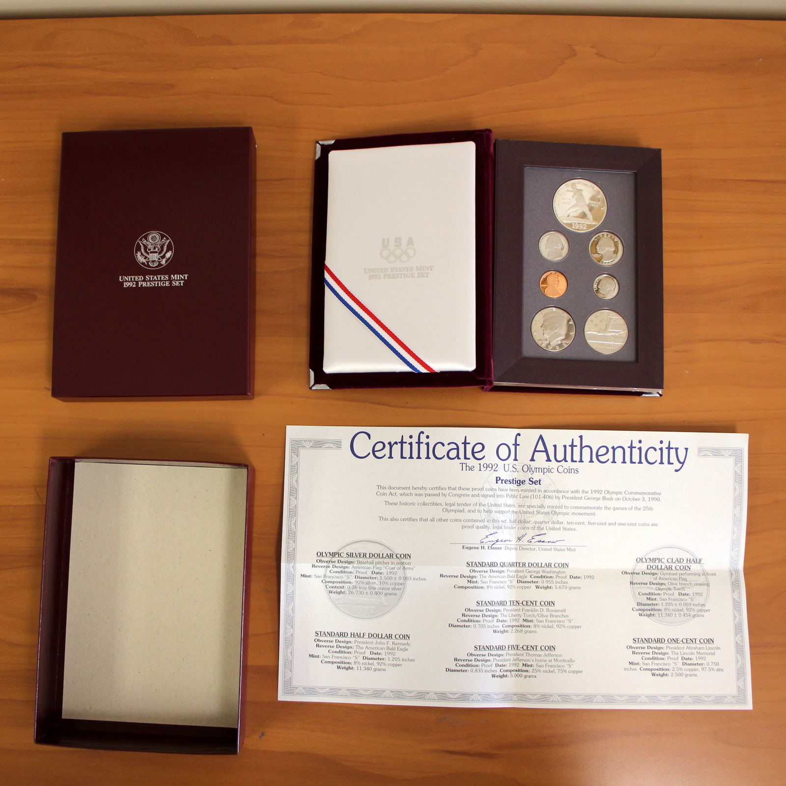 US Mint 1992 US Olympic Coin Prestige Proof Coin Set OGP: Contains one 1992 U.S. Olympic Prestige Coin Set with one 90% Silver 1992 Olympic Silver Dollar. Includes CoA, original packaging and box.