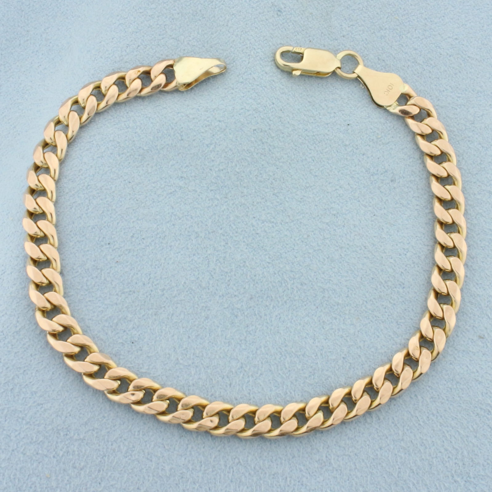 Italian Curb Link Bracelet in 10k Yellow Gold: In 10k Yellow Gold. 7 3/4 inches long. 5.3mm wide. Italian made. Lobster clasp. 7.0g.