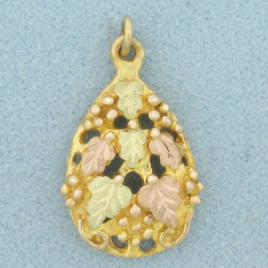 Black Hills Gold Leaf Pendant in 10k Yellow, Rose, and Green Gold: In 10k Yellow, Rose and Green Gold. 17/8 inch long. 1/2 inch wide at widest. Landstrom designer. 1.8g.