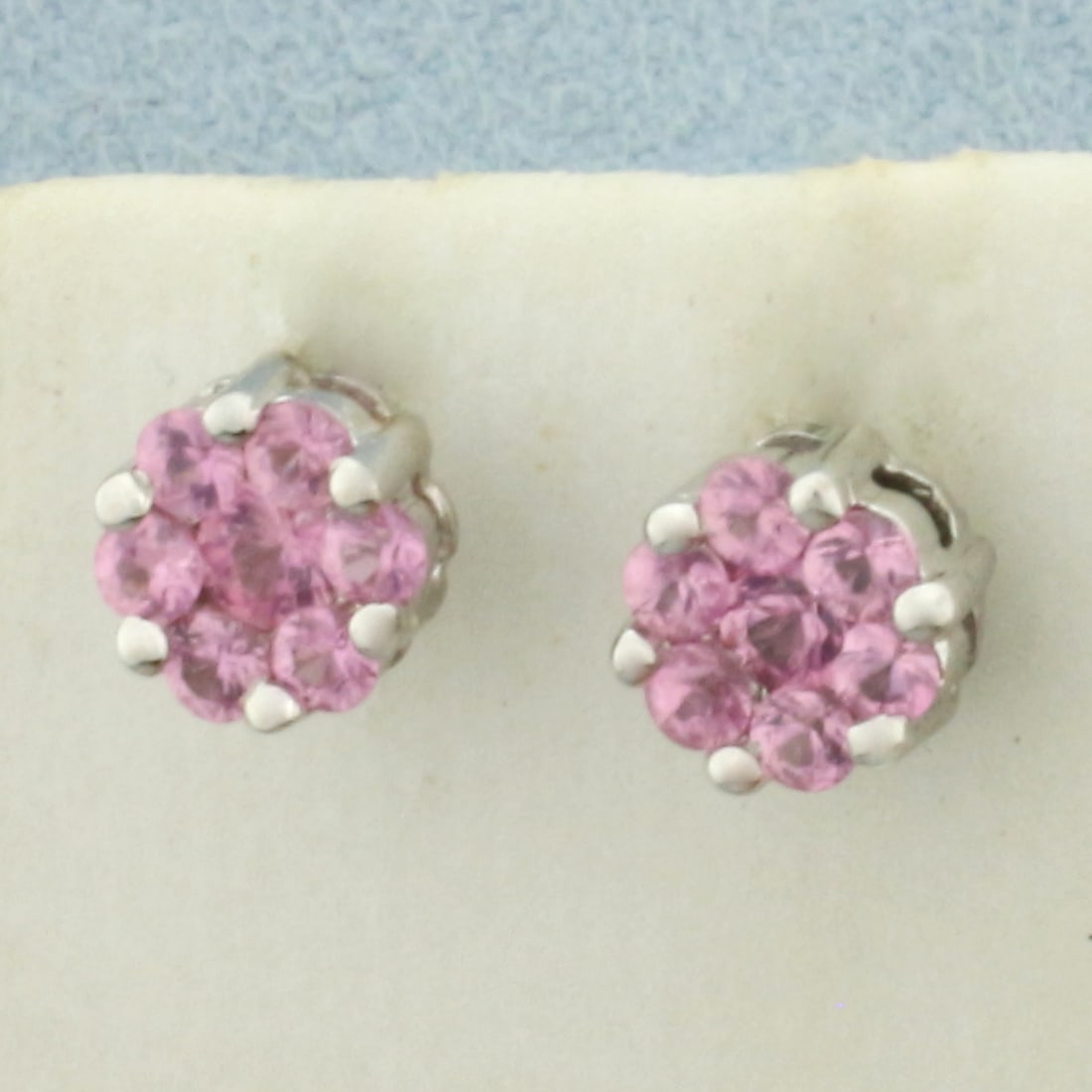 New Pink Sapphire Earrings in 14k White Gold: In 14k White Gold. Contains two 3mm and twelve 2.5mm high quality natural Pink Sapphire gemstones, approximately 1ct TW, with vibrant color and excellent clarity. 7mm wide. New condition. Friction bac