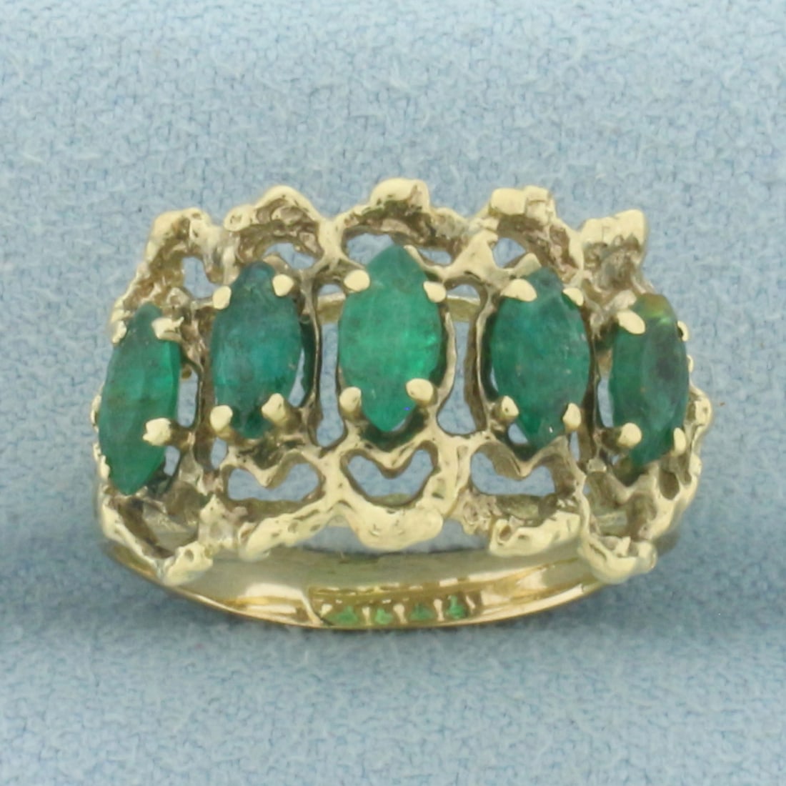 Vintage Marquise Emerald 5-Stone Ring in 14k Yellow Gold: In 14k Yellow Gold. Contains five 6x3mm high quality marquise cut natural Emerald gemstones with intense color. 12mm wide at top of ring. Size 7. 3.8g.